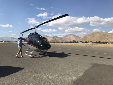 Survey helicopter parked on an airstrip near Craters of the Moon