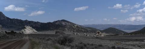 Panoramic view along a dirt road through the City of Rocks formations