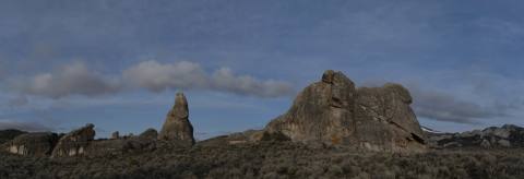 Granite spires silhouetted beneath a darkening sky