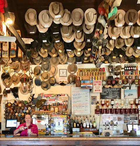 Outback hotel bar with hats and memorabilia covering the walls