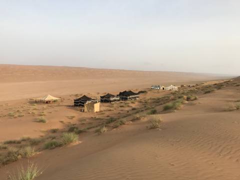 Bedouin camp nestled among the Wahiba Sands dunes